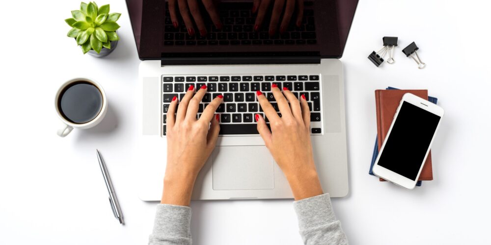 Woman working on laptop. Close up